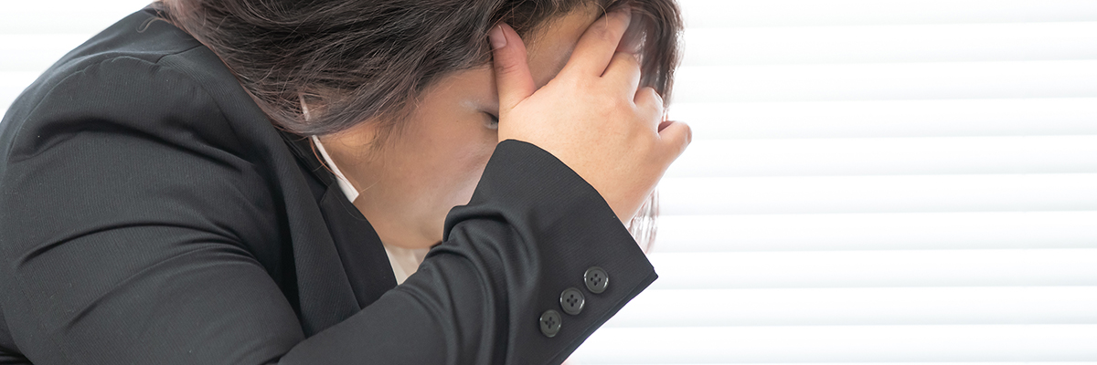 Stress anxiety East Asian woman head hand