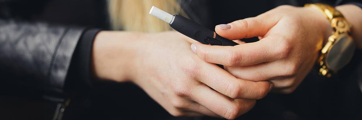 White female hands vaping pen vape